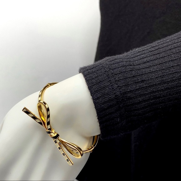 kate spade Jewelry - Kate Spade Gold Bow Bracelet Black Cream Stripes